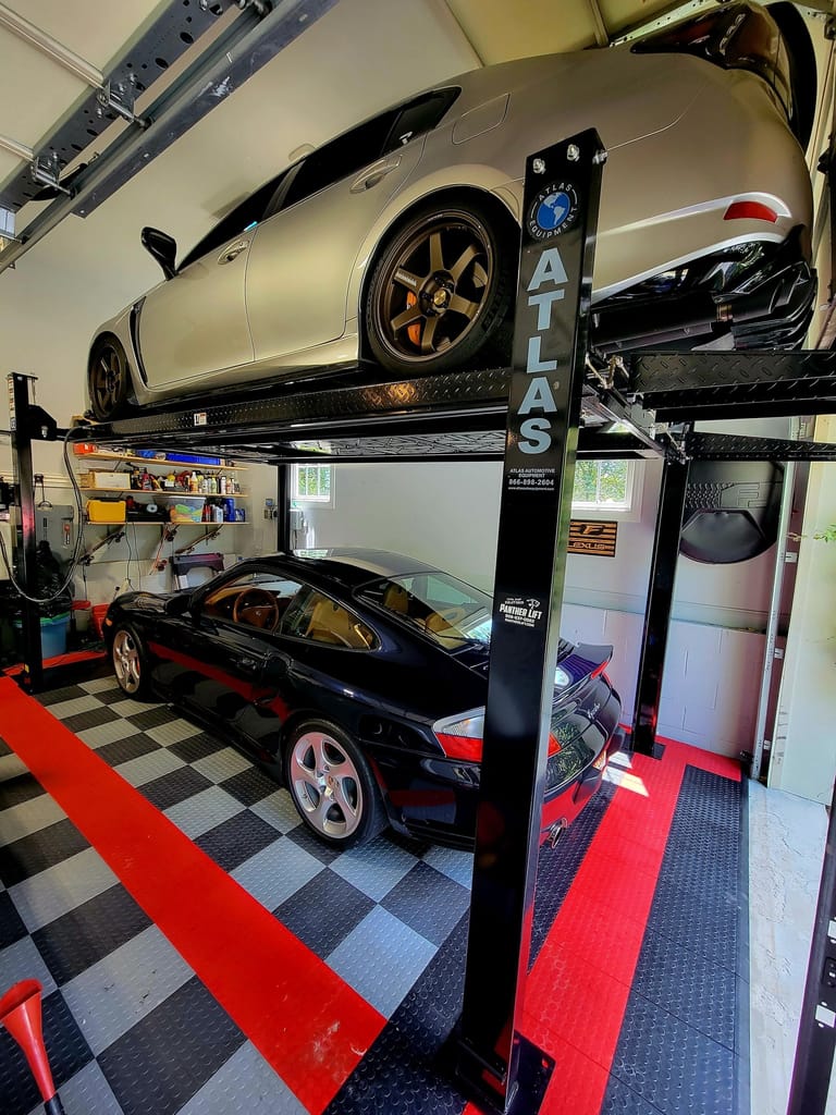Home garage storage lift with vehicle