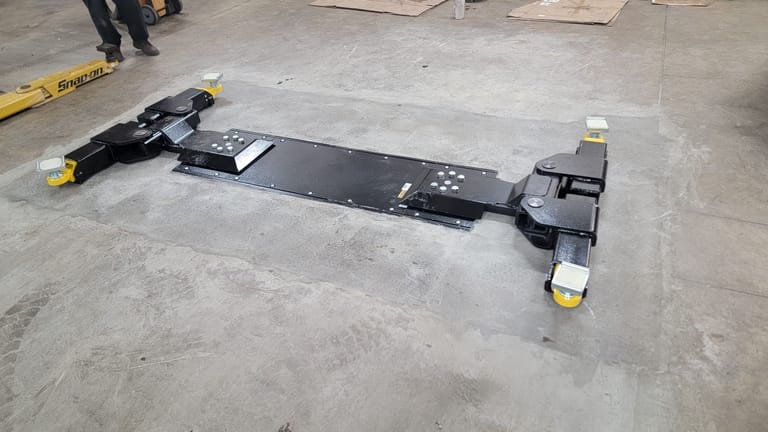 Completed inground lift installation in dealership bay