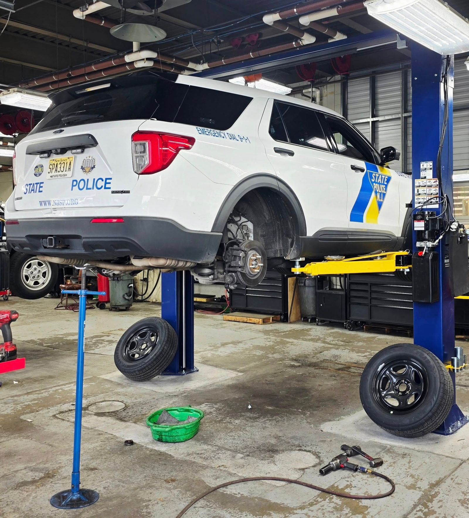 2-post lift installation in home garage