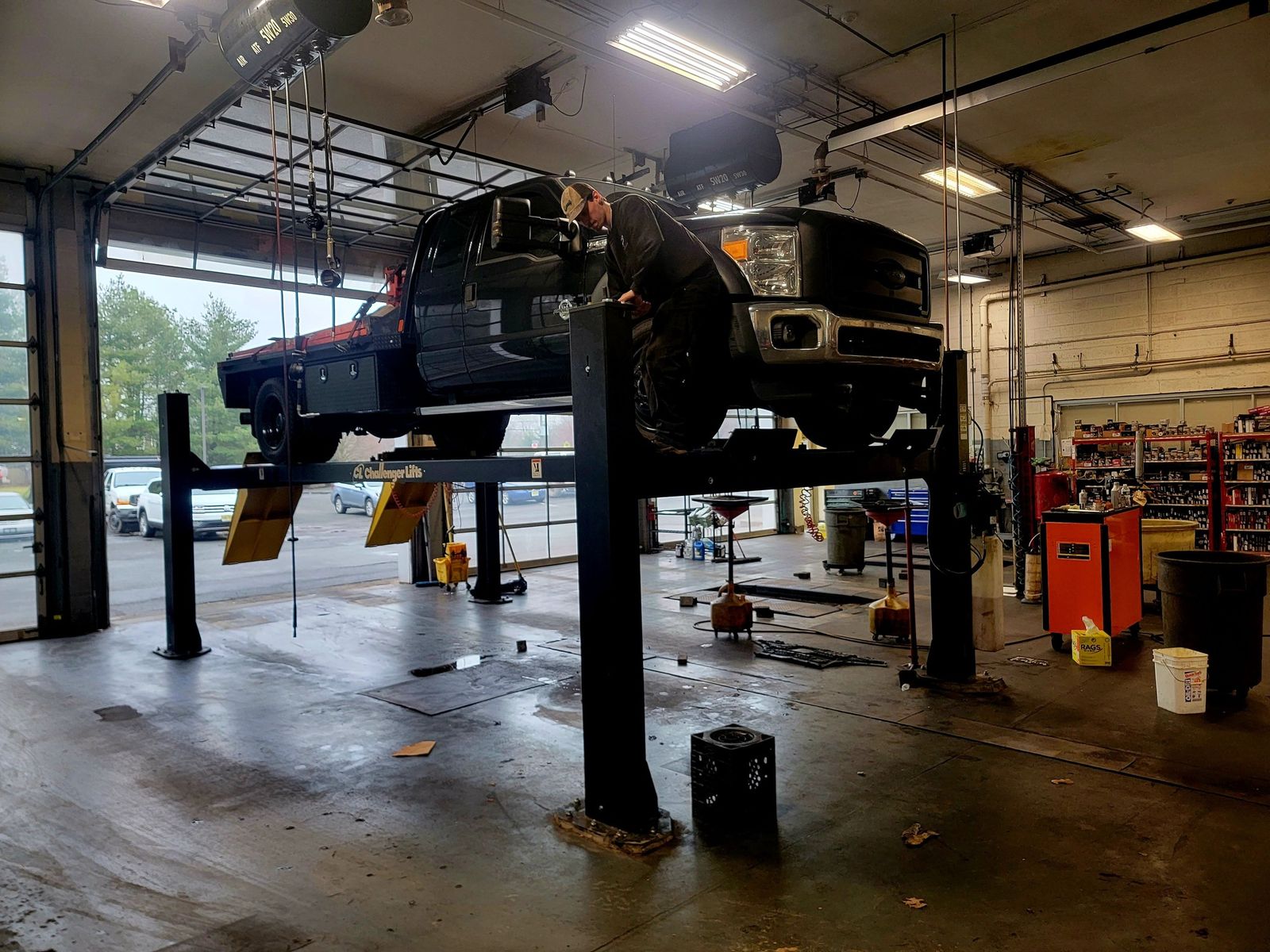 4-post service lift installed in commercial shop